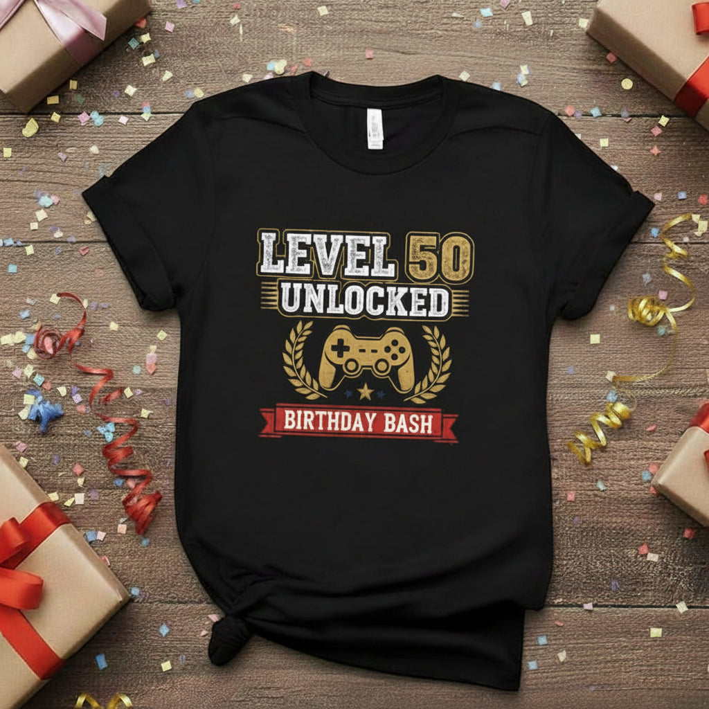 Black t-shirt with 'Level 50 Unlocked Birthday Bash' design on a wooden surface with gift boxes and ribbons.